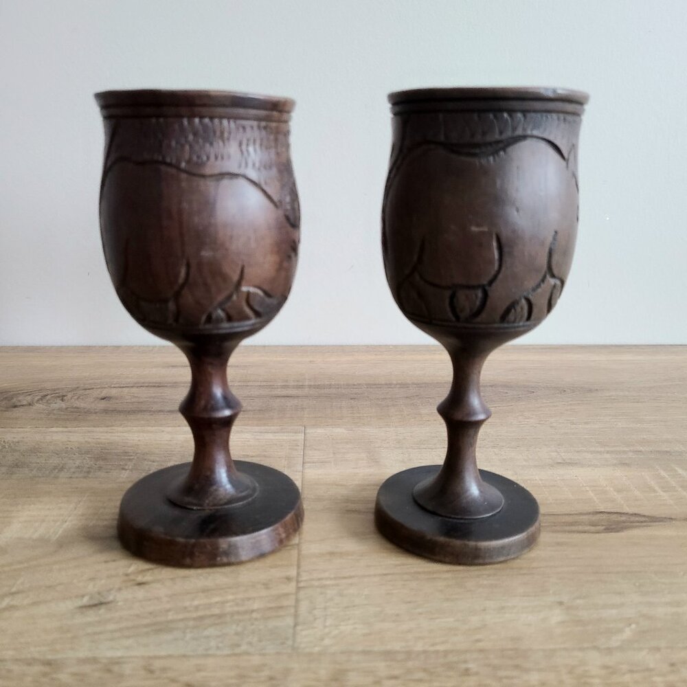 Set of 2 vintage wooden wine goblets with carved African wild animals design.